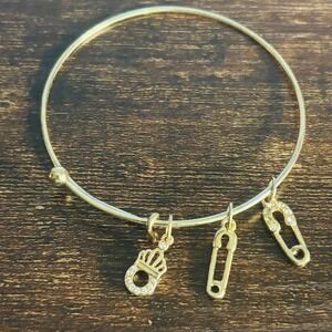 Gold Tone Expandable Bangle Bracelet Crystal Crown and Safety Pin Charms